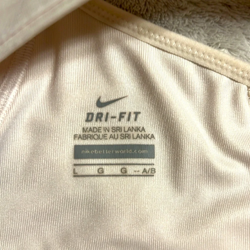 NIKE. DRI-FIT. white Woman Sport Bra. Size L, runs like M. Tags are removed.